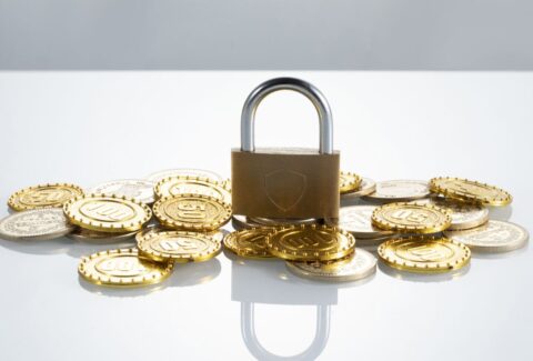 closeup-shot-of-coins-and-a-padlock-concept-of-f-2023-11-27-05-03-07-utc