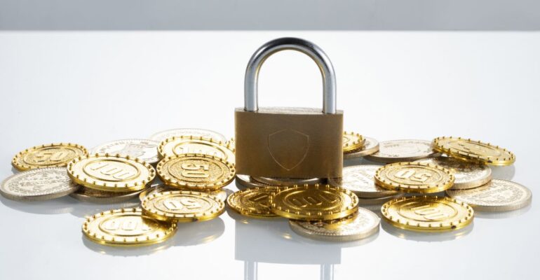 closeup-shot-of-coins-and-a-padlock-concept-of-f-2023-11-27-05-03-07-utc